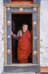 Monk in Bhutan Doorway